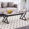 A coffee table is made of rock slab material, with a natural and smooth marble pattern on the surface